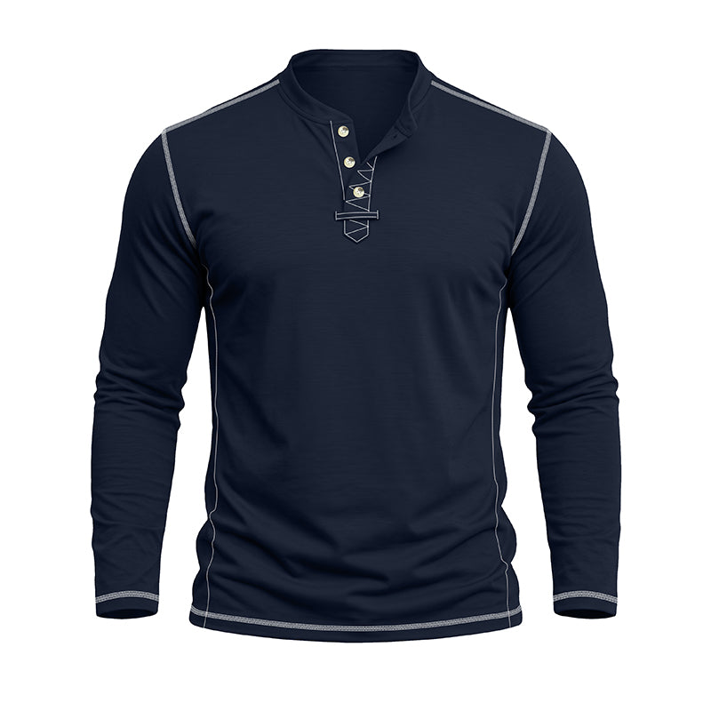 A men's long-sleeve henley shirt in dark navy blue, featuring light gray contrast stitching along the shoulders, sides, and cuffs, and a three-button placket with a small embroidered shield logo on the chest.